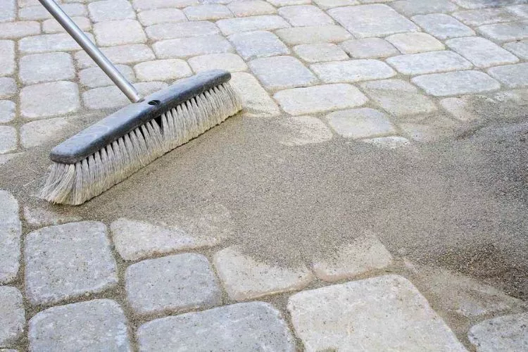 What tool removes polymeric sand from paver joints